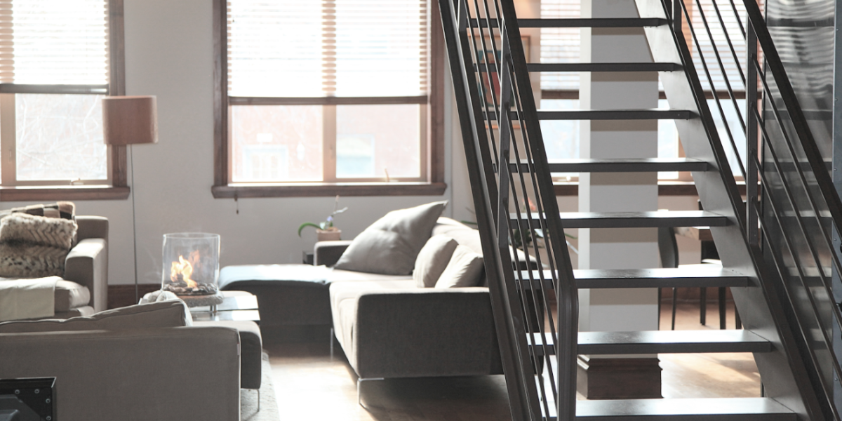 A white colored room with stairs